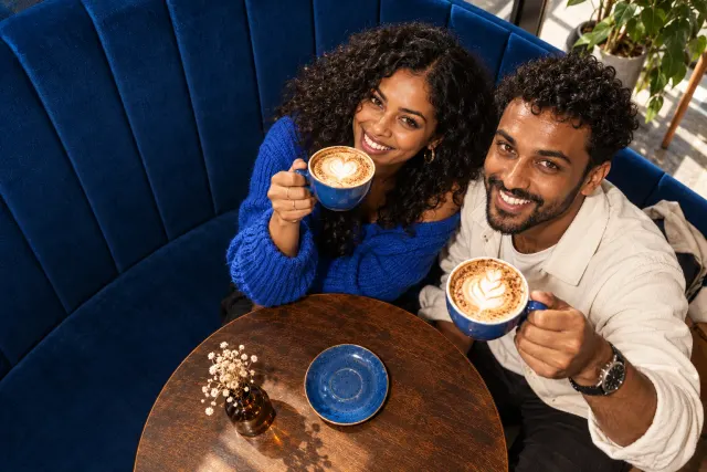 AI-created illustrative photo of two fictional adults at a cafe for Ethiopian Talo.